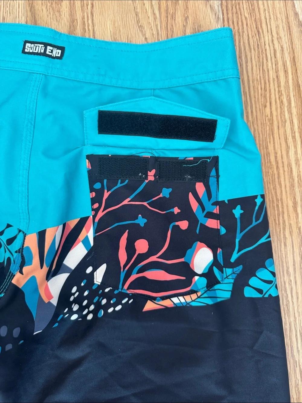 Youth Teal and Black Swim Trunks with Tropical Print
